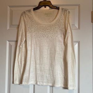 Cream colored sheer long sleeve top
